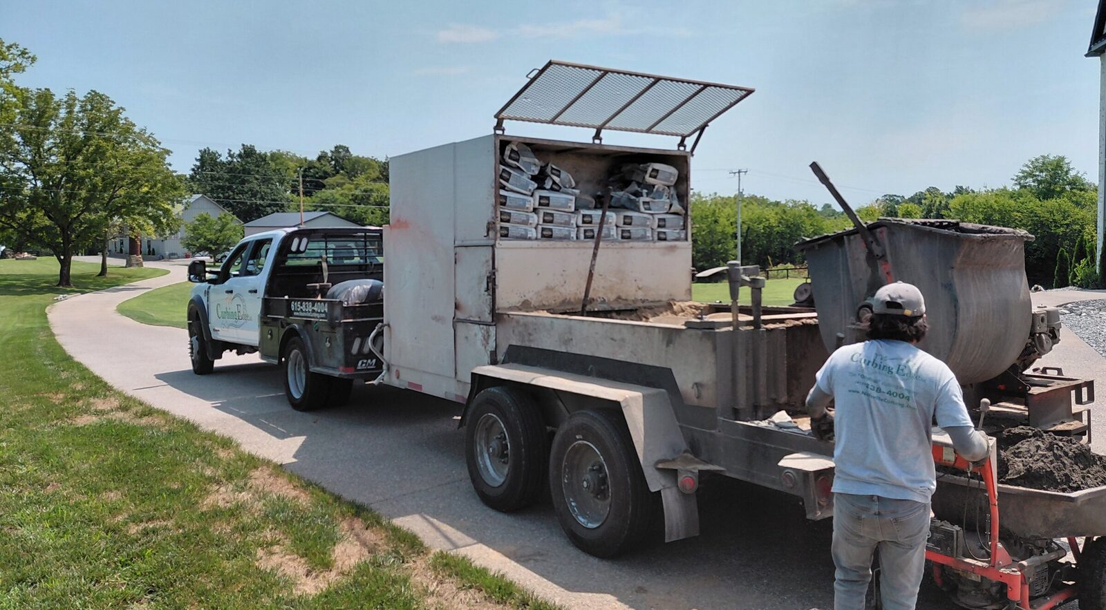 Our truck and curb-machine trailer arriving on site